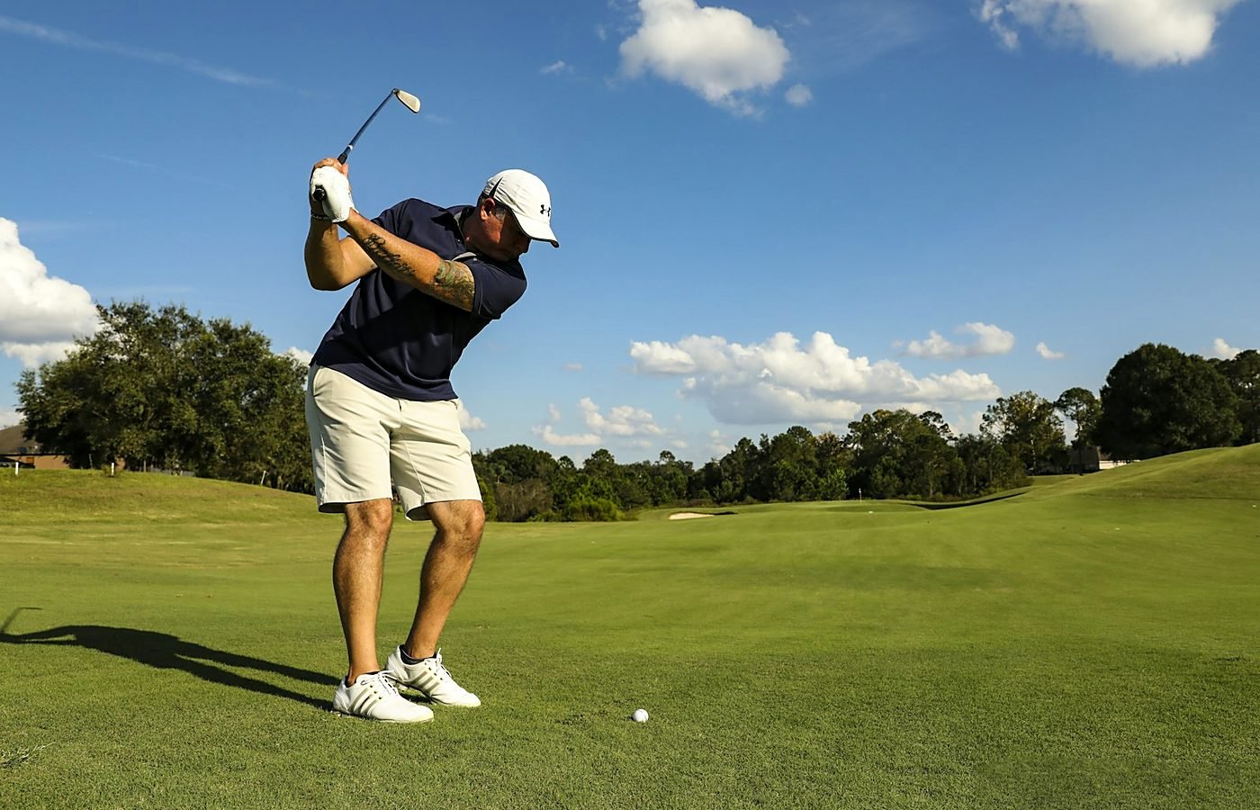 Members sharing a moment on the course at sunset, video preview