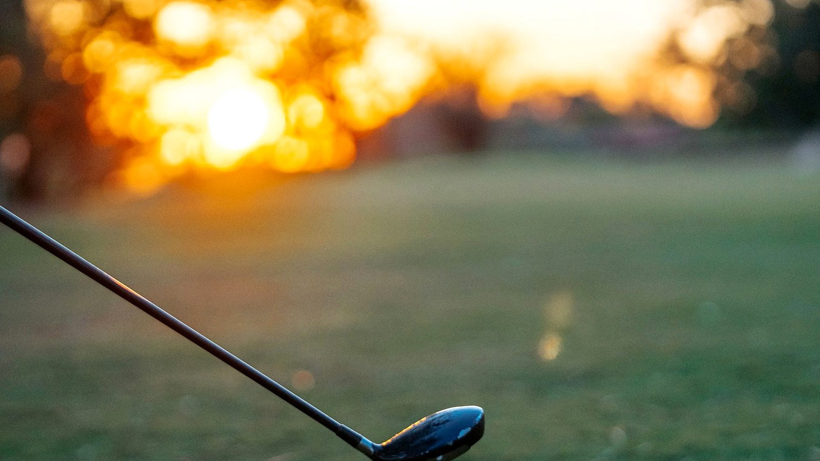 Sweeping view of a golf course fairway at dawn