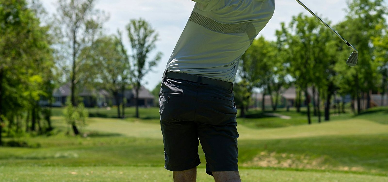 A golfer pausing on the fairway at Greenmere Golf & Country Club