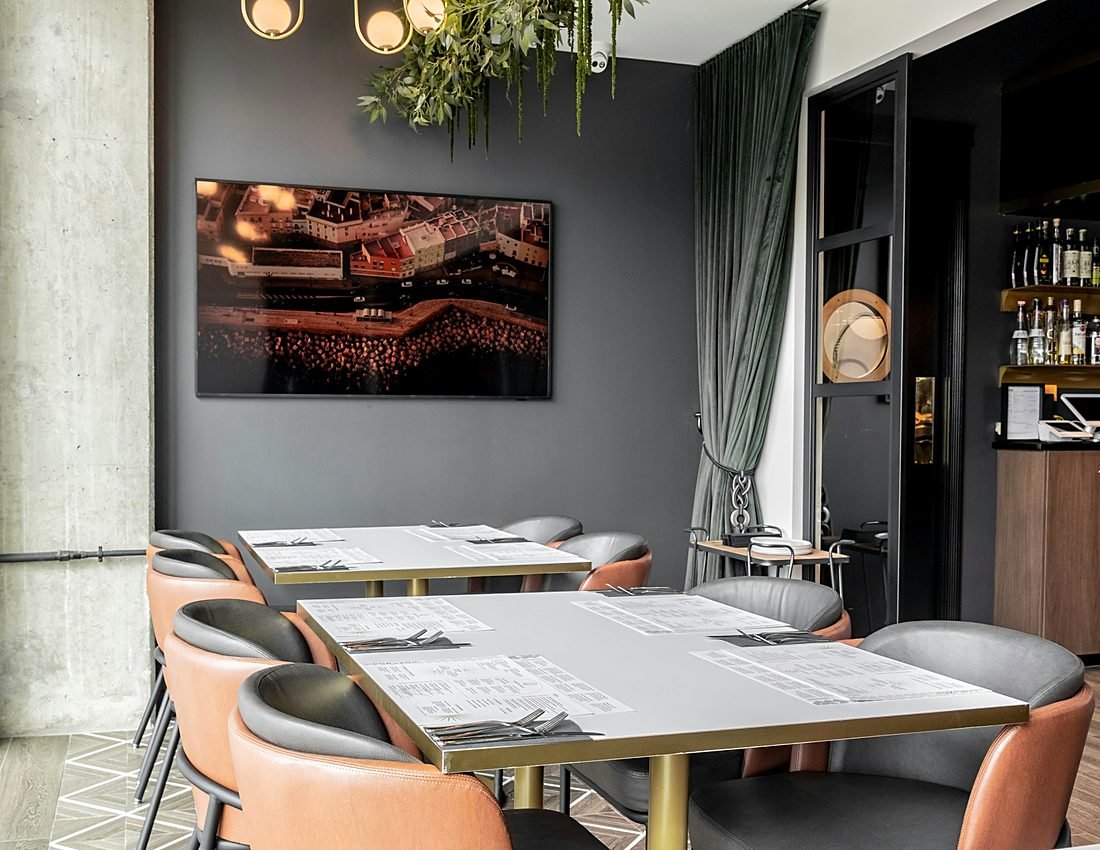 Warmly lit clubhouse bar with seating overlooking the course