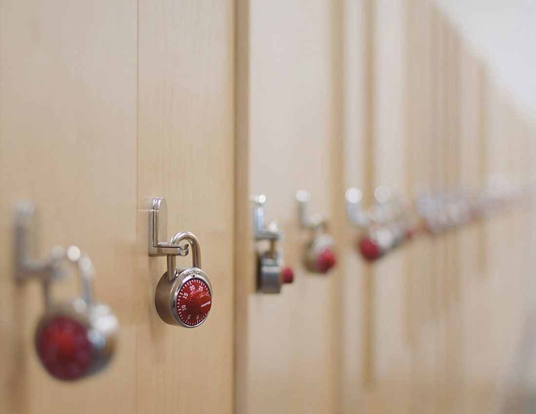 Rows of wood-paneled lockers inside the clubhouse locker room