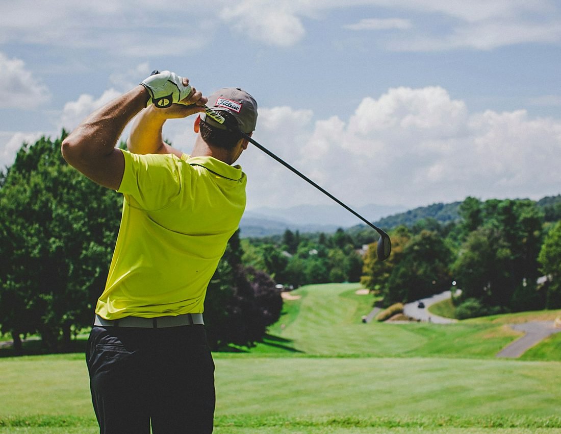 Golfers hitting balls at the outdoor practice range