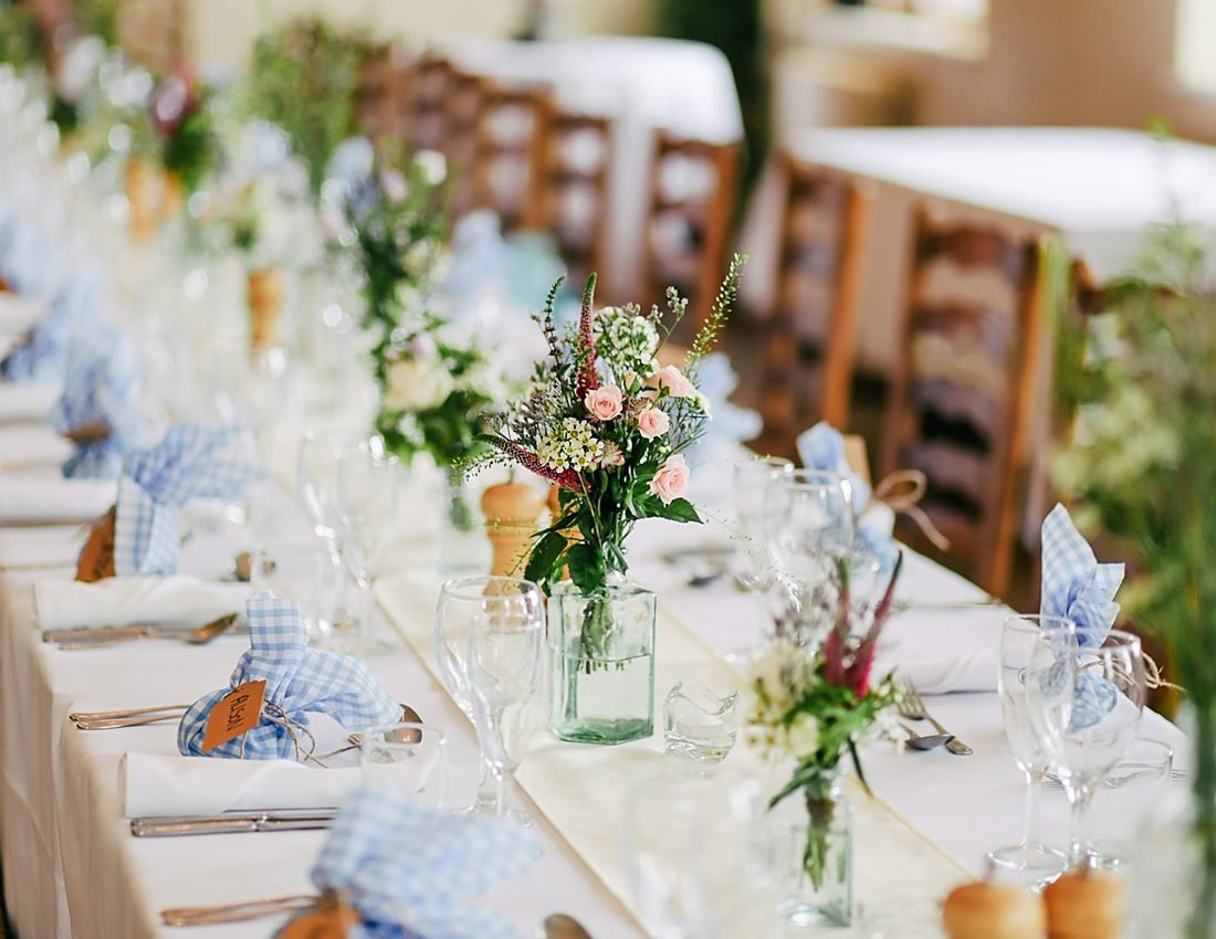 Elegantly set banquet room prepared for a private clubhouse event