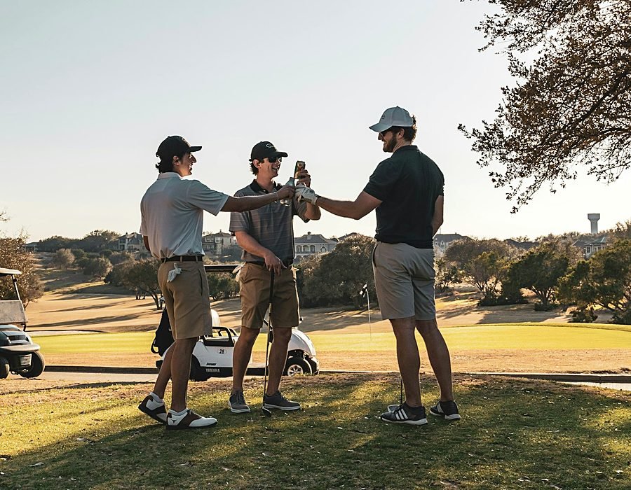 A golf instructor guiding a student through their swing