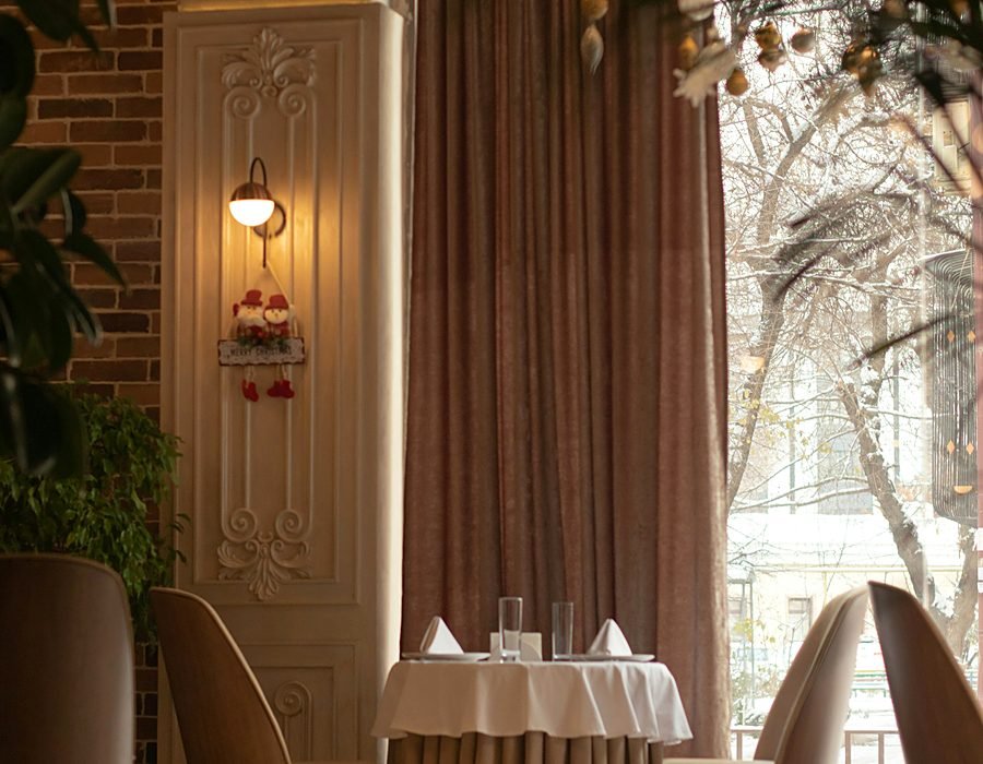 Elegant dining room set for service inside the clubhouse restaurant