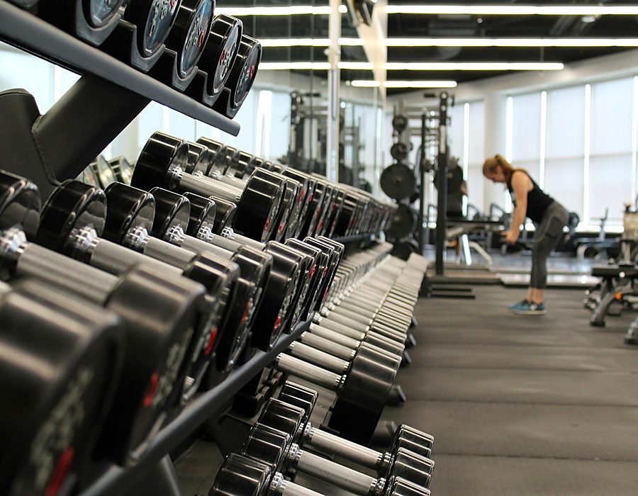 Modern fitness studio equipment inside the clubhouse wellness area