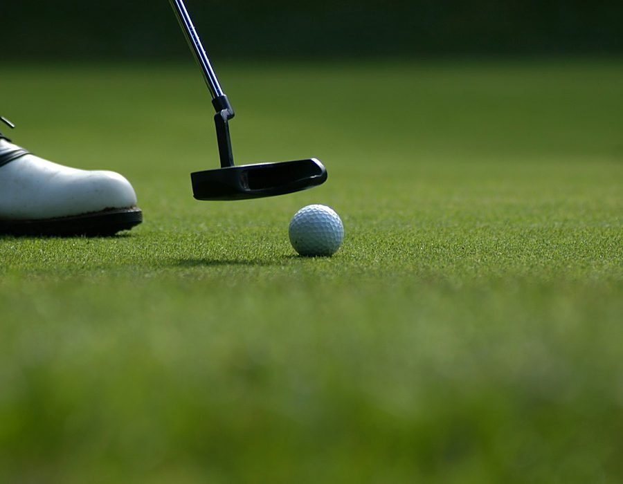 Golfers shaking hands after a friendly round on the course
